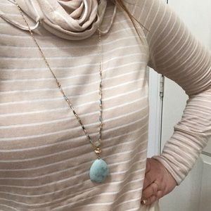 Gold chain necklace with pale green stone pendant